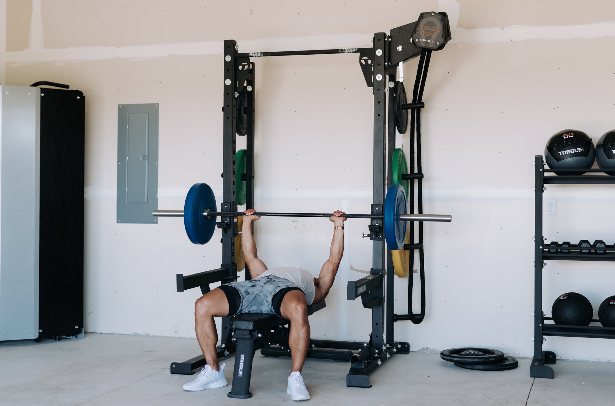 Man Lifting With Torque Equipment In Garage Gym